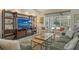 Comfortable living room featuring stylish furniture, a large TV, and an inviting atmosphere at 4444 Highland Oaks Cir, Sarasota, FL 34235