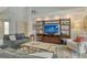 Cozy living room with built-in shelving and comfortable seating at 4444 Highland Oaks Cir, Sarasota, FL 34235