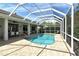 Inviting screened-in pool area with ample seating and outdoor dining space for entertaining or relaxing poolside at 4444 Highland Oaks Cir, Sarasota, FL 34235