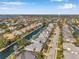 Wide aerial perspective of residences situated on a waterfront canal with easy access to the open bay at 4527 Barracuda Dr, Bradenton, FL 34208
