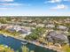 Beautiful aerial view featuring homes on a waterfront canal with direct boat access to the bay at 4527 Barracuda Dr, Bradenton, FL 34208