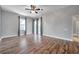 Naturally lit room with ceiling fan, vinyl floors, and a view to the lanai at 4527 Barracuda Dr, Bradenton, FL 34208