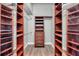 Spacious walk-in closet with custom shelving and drawers for optimal storage at 4527 Barracuda Dr, Bradenton, FL 34208