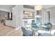 Cozy dining room featuring a glass table set and a bar with an integrated wine cooler at 4527 Barracuda Dr, Bradenton, FL 34208