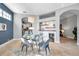 Bright dining room features modern glass table, stylish decor, and a built-in bar with wine storage at 4527 Barracuda Dr, Bradenton, FL 34208