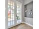 Foyer features decorative oars, tile floor, and glass paneled double doors to the outside at 4527 Barracuda Dr, Bradenton, FL 34208