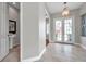 Foyer view featuring tiled floor, french doors, and powder room at 4527 Barracuda Dr, Bradenton, FL 34208
