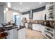 Stylish kitchen features white cabinets, stainless steel appliances, and a unique backsplash design at 4527 Barracuda Dr, Bradenton, FL 34208