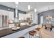 Modern kitchen with stainless appliances, white cabinets, a breakfast bar and eat-in dining area at 4527 Barracuda Dr, Bradenton, FL 34208