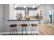 Spacious kitchen featuring a breakfast bar with wooden stools and modern appliances and finishes at 4527 Barracuda Dr, Bradenton, FL 34208