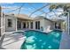 Backyard pool and patio area features a screened in lanai, pool and spa at 4527 Barracuda Dr, Bradenton, FL 34208