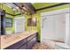 This bathroom has a long vanity and a shower at 480 58Th St, Sarasota, FL 34243