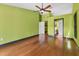 Bedroom features hardwood floors and access to the ensuite bathroom and closet at 480 58Th St, Sarasota, FL 34243