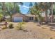 Charming single-story home featuring a well-manicured lawn, decorative stone accents and attached garage at 480 58Th St, Sarasota, FL 34243
