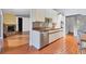 This kitchen features brick floors, stainless steel appliances, and wood countertops at 480 58Th St, Sarasota, FL 34243