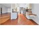 The kitchen features stainless appliances, stone floors, and a breakfast bar area at 480 58Th St, Sarasota, FL 34243