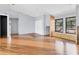 An airy living space with hardwood floors leads to the kitchen in this warm home at 480 58Th St, Sarasota, FL 34243