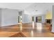 Spacious living room with wood floors, stone fireplace and sliders to the outdoor space at 480 58Th St, Sarasota, FL 34243
