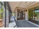Enclosed patio with tile flooring, accessible from inside, providing a transition to nature at 480 58Th St, Sarasota, FL 34243