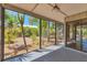 The screened patio offers picturesque views of the garden and outdoor space at 480 58Th St, Sarasota, FL 34243