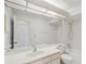 Clean and functional bathroom featuring a large mirror, vanity, and a combined shower and tub at 4829 Village Gardens Dr # 169, Sarasota, FL 34234