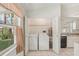 Convenient laundry room with a washer, dryer, and a window offering natural light at 4829 Village Gardens Dr # 169, Sarasota, FL 34234