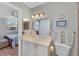 Bathroom featuring a neutral palette, white cabinetry, and a vanity at 501 Lakeside Dr # 501, Bradenton, FL 34210