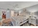 Bright bedroom with gray walls, floral bedspread, and side tables at 501 Lakeside Dr # 501, Bradenton, FL 34210