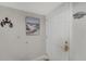 Entryway features a white door, neutral-colored walls adorned with nautical decor and tiled flooring at 501 Lakeside Dr # 501, Bradenton, FL 34210