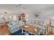 Bright living room boasting cozy seating, a decorative fireplace, and an open view into the adjacent dining area at 501 Lakeside Dr # 501, Bradenton, FL 34210