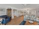Spacious living room with hardwood flooring, a cozy sofa, and easy access to the dining and kitchen areas at 501 Lakeside Dr # 501, Bradenton, FL 34210