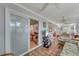 Bright and airy living space with terra cotta tile flooring, a comfortable seating area, and access to an office at 501 Lakeside Dr # 501, Bradenton, FL 34210
