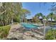 Community pool surrounded by lush landscaping, offering a refreshing escape with ample seating and lounge areas at 501 Lakeside Dr # 501, Bradenton, FL 34210