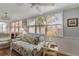 Cozy sunroom with a comfortable sofa, large windows, and terra cotta tile flooring at 501 Lakeside Dr # 501, Bradenton, FL 34210