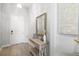 Inviting foyer featuring neutral walls, elegant console table, and decorative mirror, creating a warm welcome at 5235 Coral Reef Way, Bradenton, FL 34211