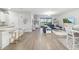 Open-concept living space with hard flooring, a view of the pool, and abundant natural light at 5235 Coral Reef Way, Bradenton, FL 34211