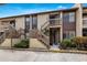 Charming two-story condo with wooden staircase, beige exterior, and inviting curb appeal at 5729 Avista Dr, Sarasota, FL 34243