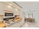 Well-lit kitchen with white cabinets and a view to a cozy breakfast nook at 5729 Avista Dr, Sarasota, FL 34243
