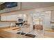 Bright, tidy kitchen featuring white cabinets, light countertops and view into dining area at 5729 Avista Dr, Sarasota, FL 34243