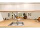 View from kitchen showing the open layout of the dining and living areas at 5729 Avista Dr, Sarasota, FL 34243