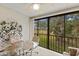 Relaxing lanai space with seating, and a view of the lush green landscape at 5729 Avista Dr, Sarasota, FL 34243