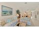 Cozy living room featuring floral sofas, artwork, and open dining area with lots of natural light at 5729 Avista Dr, Sarasota, FL 34243