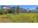Spacious backyard showcasing well-maintained green grass, providing plenty of room for outdoor activities and recreation at 5833 Millennium Silver Ct, Sarasota, FL 34238