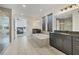 This bathroom features white tile floors, a soaking tub, dual sinks, and access to the bedroom at 5833 Millennium Silver Ct, Sarasota, FL 34238