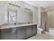 Spacious bathroom with double vanity, modern lighting, and neutral finishes at 5833 Millennium Silver Ct, Sarasota, FL 34238