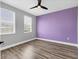 Bedroom with wood floors offers natural light and a calming atmosphere at 5833 Millennium Silver Ct, Sarasota, FL 34238