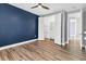 Bedroom with hardwood floors with a walk in closet offers ample space at 5833 Millennium Silver Ct, Sarasota, FL 34238