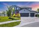 Beautiful two-story home with well-manicured lawn and a three-car garage at 5833 Millennium Silver Ct, Sarasota, FL 34238
