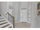 Bright foyer with tile flooring, front door, and a decorative message at 5833 Millennium Silver Ct, Sarasota, FL 34238
