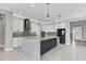 Modern kitchen featuring granite countertops, a stylish island, and stainless steel appliances at 5833 Millennium Silver Ct, Sarasota, FL 34238